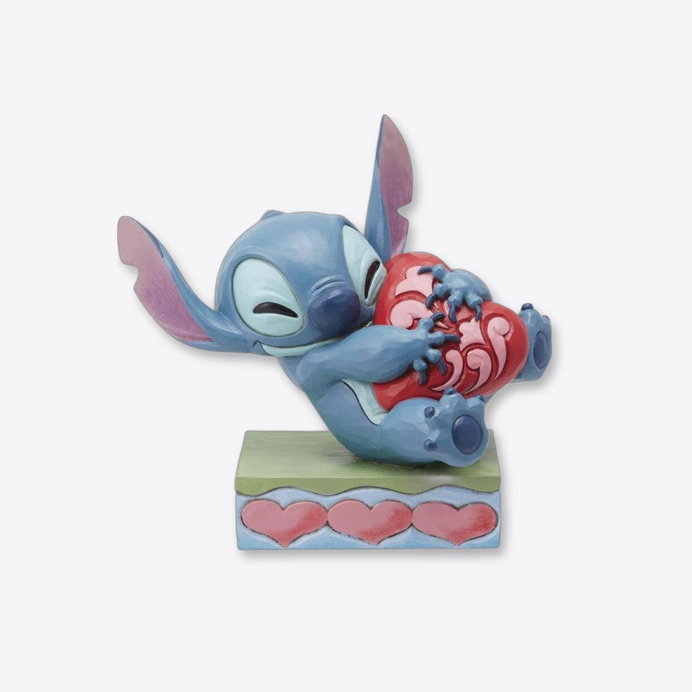 Figura enesco disney stitch abrazando un corazón (imagen 2 de 6)